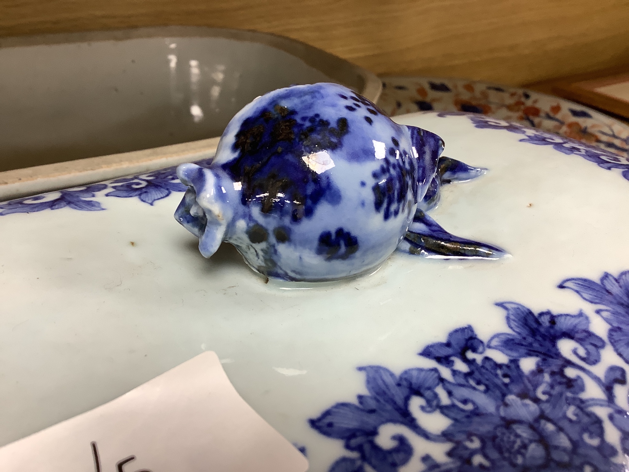 Two 18th century Chinese export blue and white lidded tureens, one lacking cover, 34cm